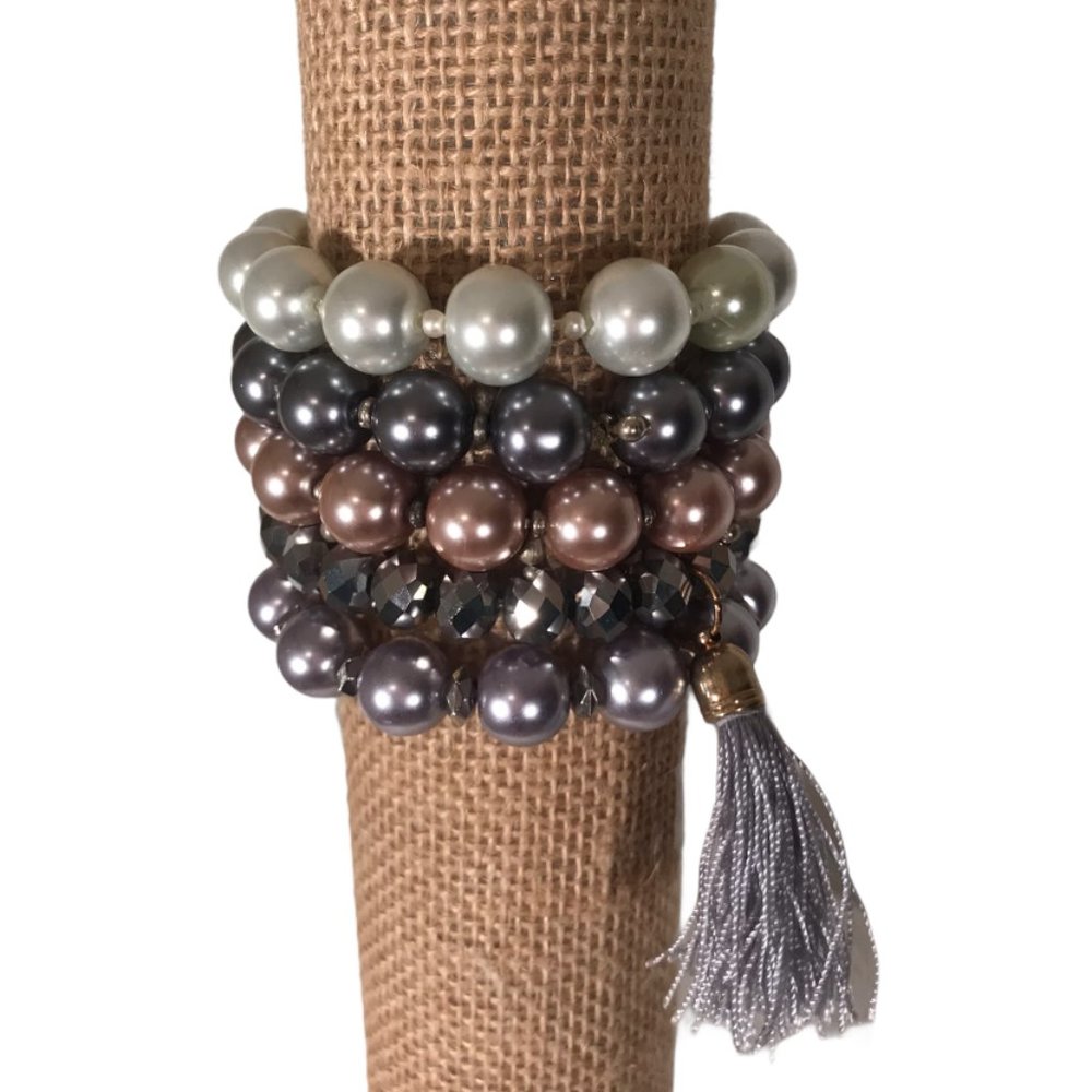 Stack of ALI KHAN c.A.K.e Bracelets Tassel Beads